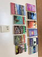 All 11 paperbacks laid out, front covers visible