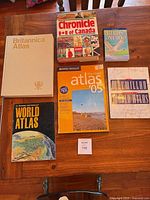 All six books arranged on table showing covers