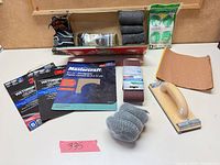 Overview of all abrasive items laid out on table