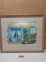 Full view of framed watercolor with mat and wood frame
