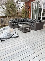 Full view of sectional and coffee table on deck