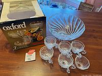 Box, punch bowl and six cups visible