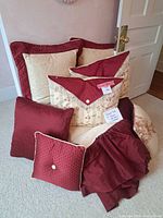 Group shot of comforter set showing pillows, bed skirt and partial comforter