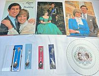 Overview showing three books, four boxed spoons and commemorative plate