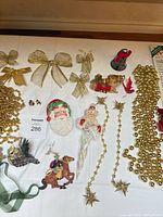 Overall view with bows, garlands, Santa ornaments and various pieces