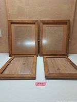 Four light oak wood picture frames front view