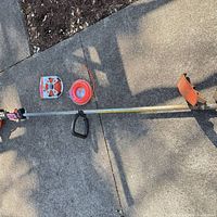 Full view of Stihl FS 74 trimmer with two trimmer line spools