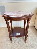 Full view of mahogany side table showing marble top and lower shelf