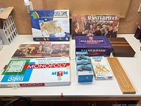 Group shot showing all nine boxed games and accessories