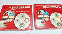 Two red Kenner Spirograph boxed sets side by side
