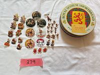 Group view of all pins, badges and tin
