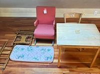 Overall view of rocking chair, table, chair, crib parts and mattress