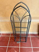 Front view of wrought iron arched wine rack