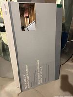 Boxed wall mirror showing size and product details