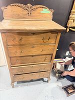 full front view of dresser showing five drawers, hardware, overall wear