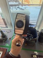 Front view of Bell & Howell Optronic camera showing lens and Super Eight marking