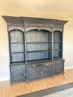 Full view of two-piece black distressed wood hutch showing overall structure