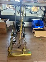 Overall lot with tool stand, tools and brass andirons visible