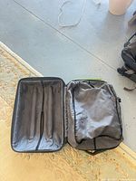 Large suitcase opened to show interior and structured base