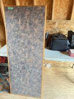 Brown laminate top standing upright