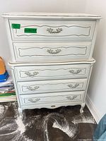 Front view showing five drawers, distressing, hardware