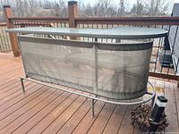 Full view of bar table on deck, mesh skirt visible