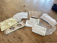 Full layout showing placemats, table covers, runner and crochet pieces