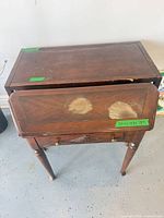 Top of accent table showing veneer damage and drawer front
