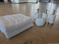 Full set: towel, bathmat, toothbrush holder, three dispensers