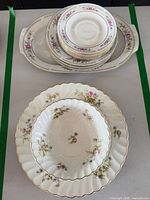Overall lot showing stacked Johnson Bros plates in platter and GDR fluted pieces