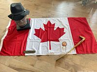 Overview showing flag, bust with hat, Captain plaque, shoehorn, paperweight