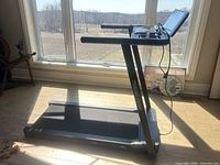 Side view of Mobvoi treadmill showing full frame and console