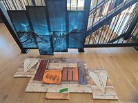 Both canvas sets laid out: landscape set upright, typographic set on floor