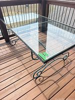 Full view of glass top table on deck
