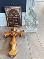Front view of cross, plaque and figurine