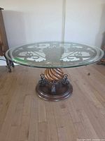 Full view of round glass top table in room