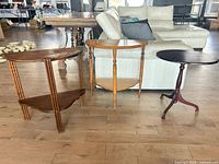 All three side tables together showing styles and finishes