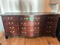 Full front view of dresser showing nine drawers and overall condition