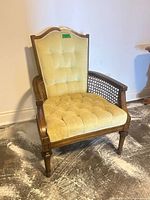 Front view of French Provincial armchair