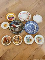 Group shot of all ten decorative plates laid out on floor