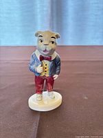 Front view of Beswick Algy Pug figurine standing on base