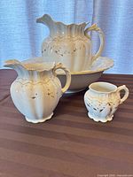 Full chamber set showing large pitcher, basin, small pitcher, shaving mug