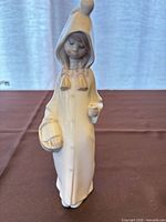 front view of entire figurine standing upright