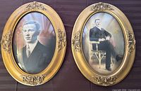 Front view of both oval gilt framed portraits