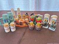 All eleven shaker pairs grouped together on table