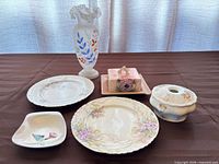 Group shot of all six porcelain and ceramic items