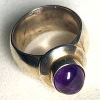 Wide sterling band with oval amethyst cabochon front view