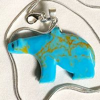 Front view of turquoise howlite bear pendant on sterling snake chain