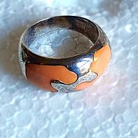 Top view of sterling silver ring showing pink inlay pattern