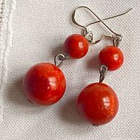 Pair of coral bead earrings showing front view and bead arrangement